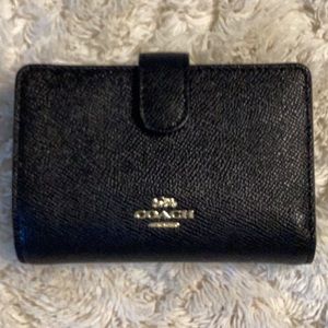 Coach black medium wallet.